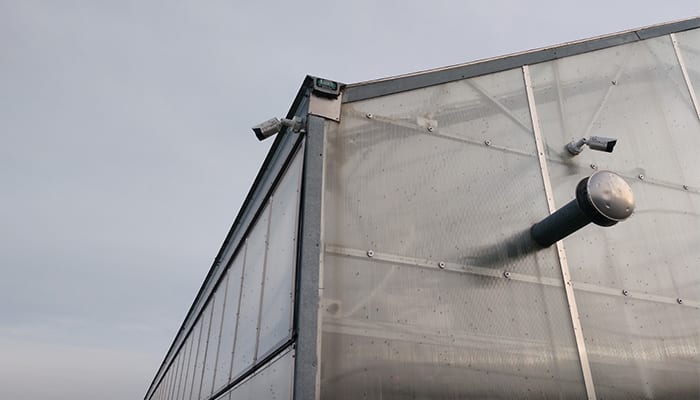 multiple-surveillance-cameras-on-a-building multiple-surveillance-cameras-on-a-building